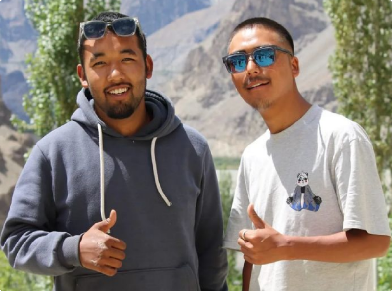 Tourists enjoying a scenic view in Ladakh